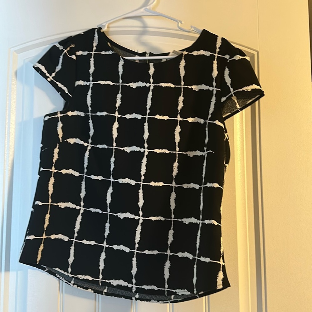 Black and white sleeveless blouse